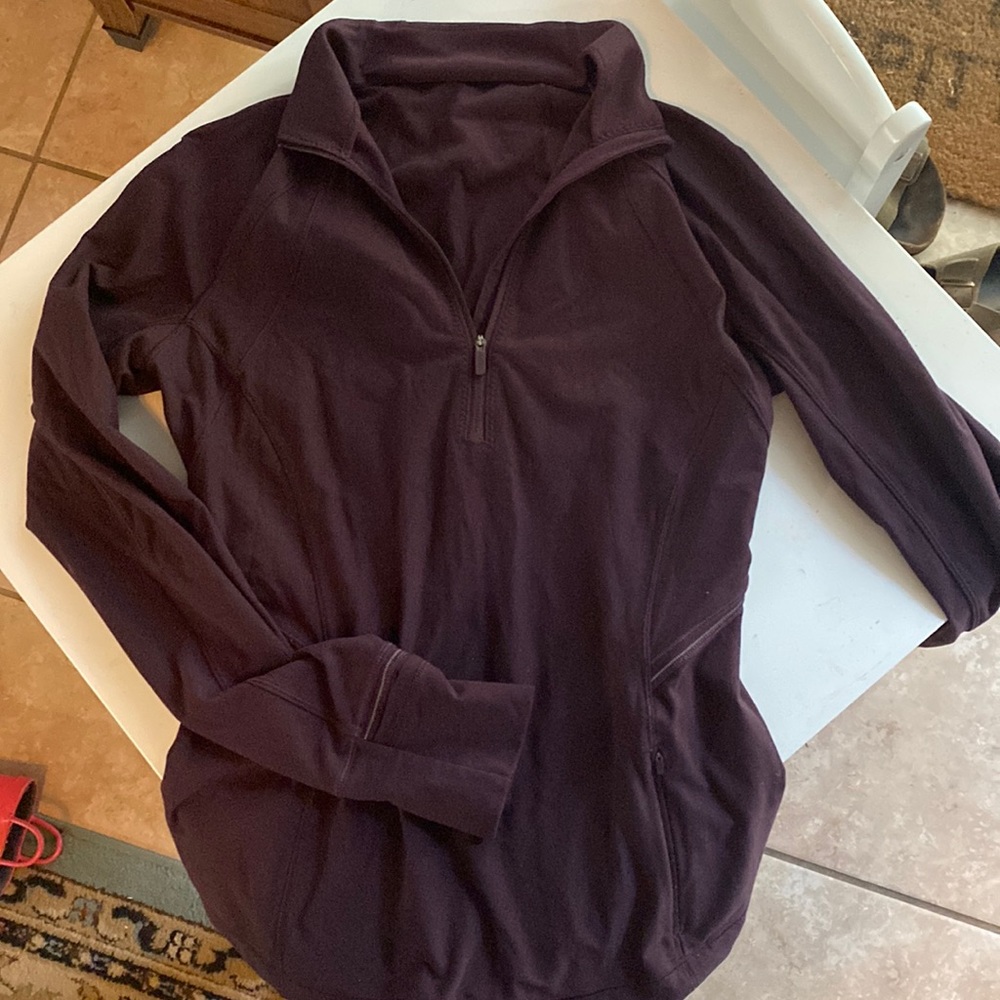 Lululemon long sleeved half-zip with pocket.
